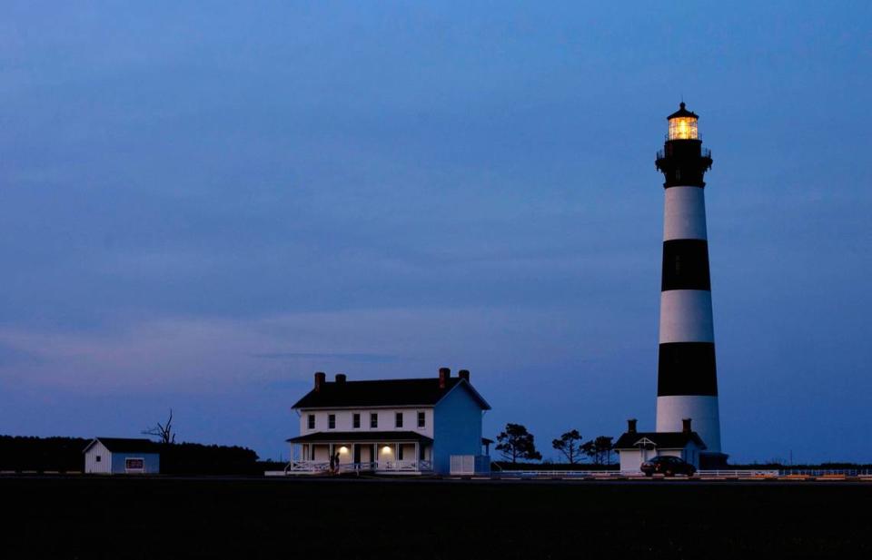 The Bodie Island Lighthouse is illuminated as dusk falls on at the Cape Hatteras National Seashore on the outer banks of North Carolina in 2015. Robert Willett/rwillett@newsobserver.com