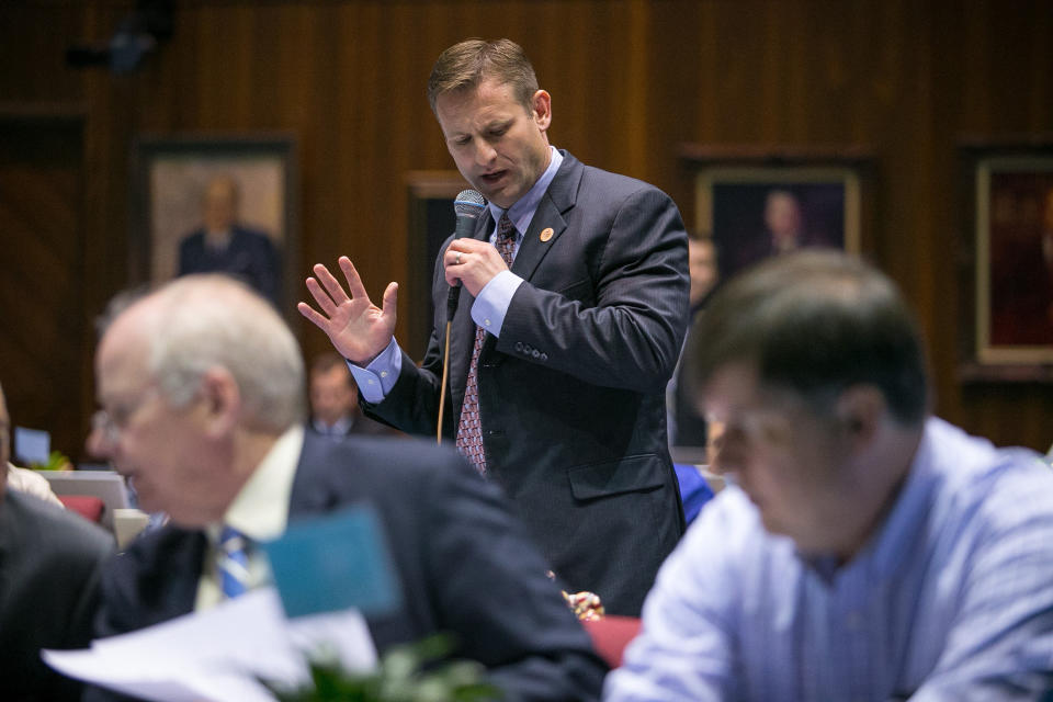 CORRECTS TO JUSTIN PIERCE-Republican Rep. Justin Pierce argues in favor of a bill that Republicans say just confirms religious rights. on the House Floor in Phoenix on Thursday, Feb. 20, 2014. House Bill 2153, written by the conservative advocacy group Center for Arizona Policy and the Christian legal organization Alliance Defending Freedom, would allow individuals to use religious beliefs as a defense in a lawsuit filed by another individual. (AP Photo / The Arizona Republic, Michael Schennum)