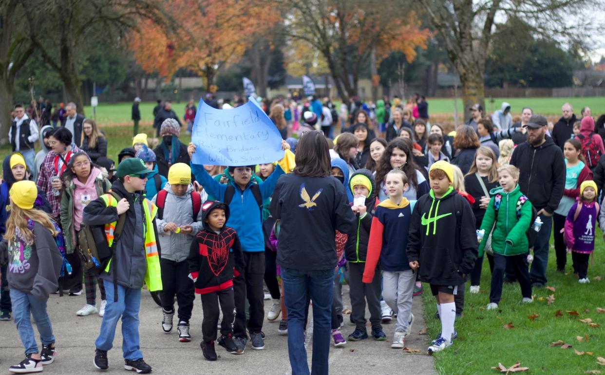 Fairfield Elementary School students head to school, led by Principal Jenny Sink, for the annual Ruby Bridges Walk to School Day on Tuesday.