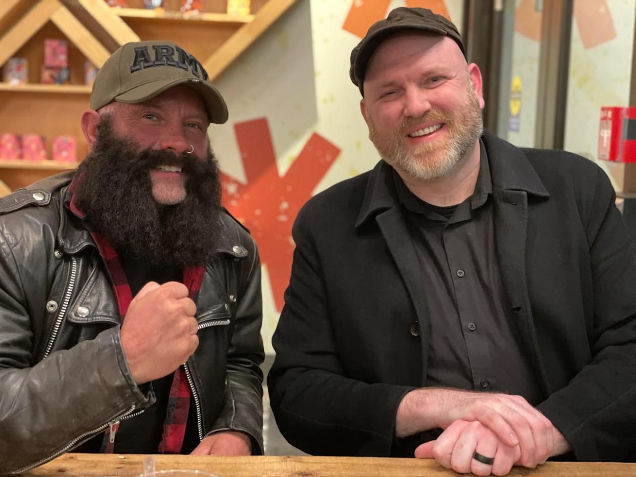 Before reuniting in person, Darrell Leon, left, gave Jesse Stewart, right, a heads-up that a lot has changed in 30 years, joking that he now looks like 'a cross between a Viking and a biker.'  (Submitted by Michele McMillan - image credit)