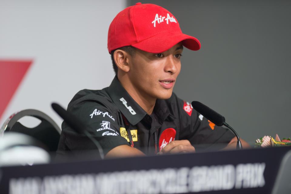 KUALA LUMPUR, MALAYSIA - OCTOBER 20: Muhammad Zulfahmi Khairuddin of Malaysia and Air Asia-SIC-Ajo speaks and celebrates his first Pole Position in Moto3 during the press conference at the end of the qualifying practice of the MotoGP Of Malaysia at Sepang Circuit on October 20, 2012 in Kuala Lumpur, Malaysia. (Photo by Mirco Lazzari gp/Getty Images)