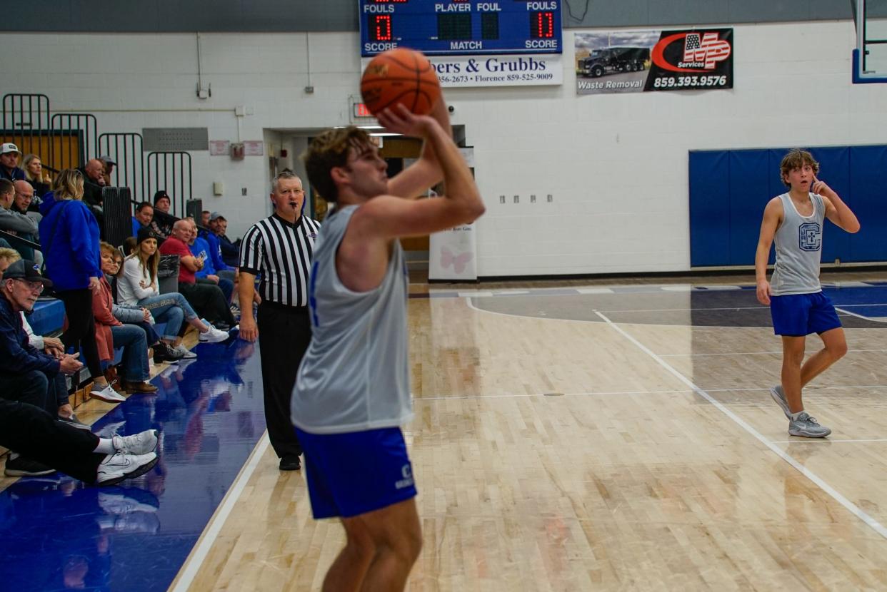 Covington Catholic's Brady Hussey squares up a three-pointer during the Colonels' game against Oak Hills at the Kelsey Sorrell Memorial Scrimmages at Simon Kenton High School on Nov. 18, 2023.