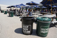 Recycle containers are placed in the eating area at the Indianapolis 500 auto race at Indianapolis Motor Speedway, Friday, May 20, 2022, in Indianapolis. (AP Photo/Darron Cummings)