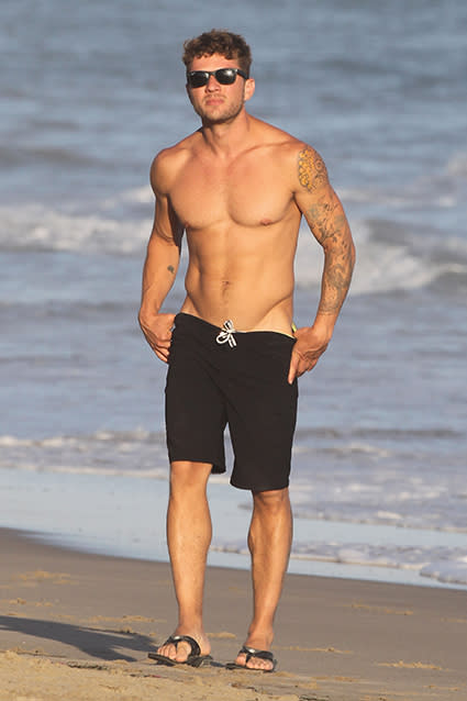 Ryan Phillippe is obviously aging quite nicely. The <em> Cruel Intentions </em>actor and dad-of-three showed off his super-fit physique on the beach in Malibu, California on Sunday, going shirtless. He's 40?! <strong>PHOTOS: Hollywood's Sexiest Shirtless Men</strong> Splash News Phillippe was accompanied by his girlfriend, 24-year-old law student Paulina Slagter. The <em>MacGruber</em> star has talked about his age-defying looks in the past, telling <em> Variety</em> in March that people actually sometimes mistake him for the brother of his 15-year-old daughter, Ava Phillippe. "I get carded constantly," he admitted. "My daughter hates it, because sometimes people have thought I'm her brother, and she’s freaked out by that." Speaking of Ava, Phillippe also revealed to <em>Elle </em>in March that he has the same personality traits as his teenage daughter with his ex-wife, Reese Witherspoon. Specifically, he said the two share an intense sense of empathy. "You know, depression has been a huge obstacle for me ever since I was a child," Phillippe revealed. "As you get older I think it decreases some, but I'm just innately kind of a sad person. I'm empathetic, and I take on the feelings of others and transpose myself into the position of others. I see it in my daughter." <strong>WATCH: EXCLUSIVE '54' Clip -- Ryan Phillippe's Shirtless Boogie Restored in Director's Cut</strong> Watch below: