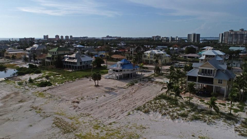 This aerial view along part of the beach coastline in the southern end of Fort Myers Beach was photographed Tuesday, August 8, 2023. Fort Myers beach is undergoing a gentrification process where middleclass families are being forced off the island because they can't afford to rebuild their homes to code and FEMA standards.
