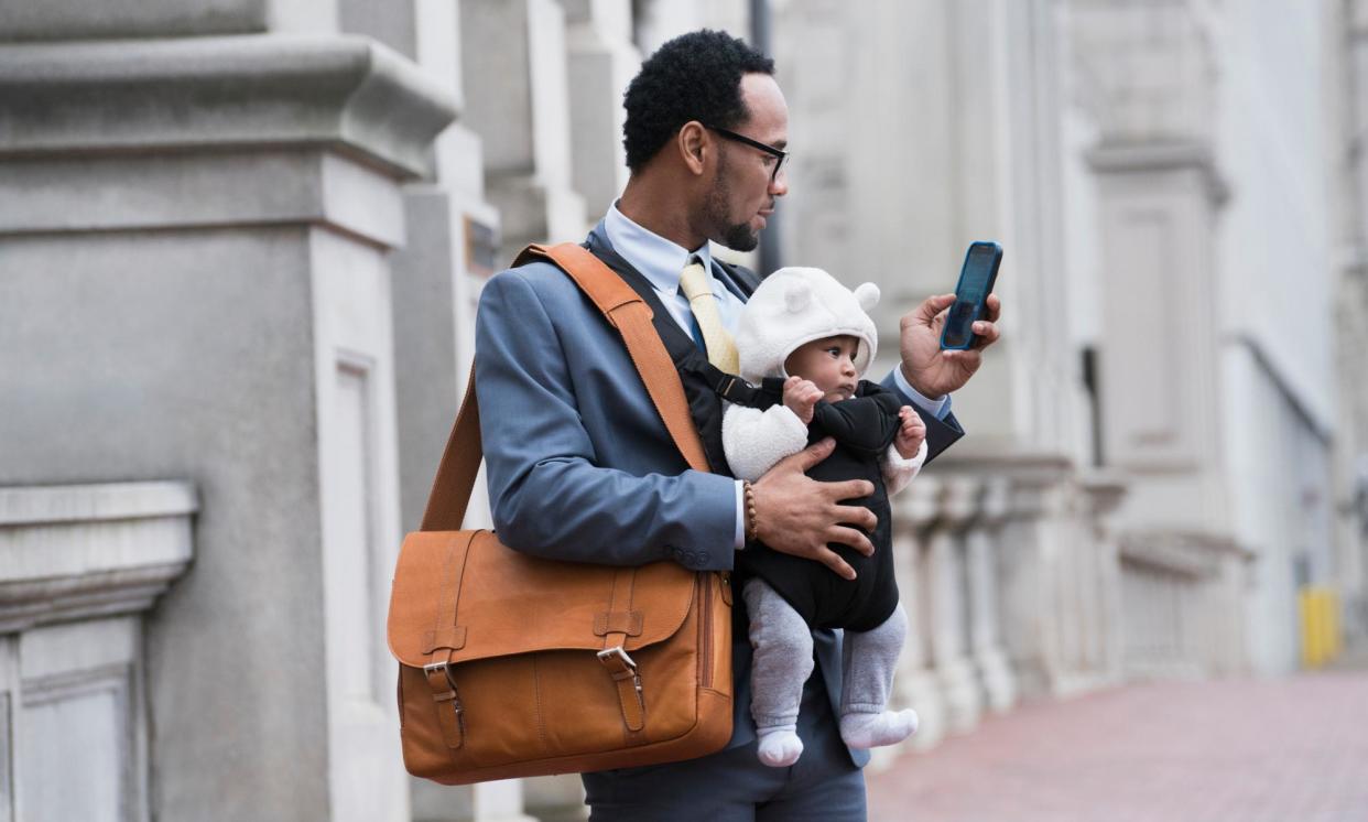 <span>‘What I did discover, though, is that carrying a baby seems to make you public property.’</span><span>Photograph: Ariel Skelley/Getty Images</span>