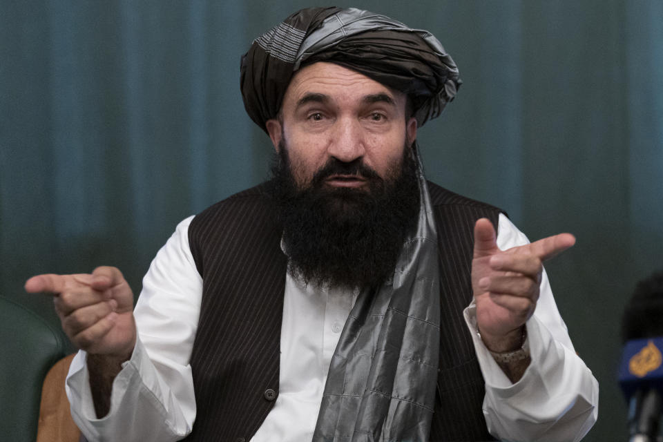 Khairullah Khairkhwa, former western Herat Governor and one of five Taliban released from the U.S. prison on Guantanamo Bay in exchange for U.S. soldier Bowe Bergdahl, gestures during a joint news conference in Moscow, Russia, Friday, March 19, 2021. The Taliban warned Washington against defying a May 1 deadline for the withdrawal of American and NATO troops from Afghanistan promising a "reaction". (AP Photo/Alexander Zemlianichenko, Pool)