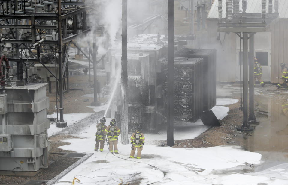 Members of the Madison Fire department respond at the scene of a fire at Madison Gas and Electric, Friday, July 19, 2019 in Madison, Wis. (Steve Apps/Wisconsin State Journal via AP)