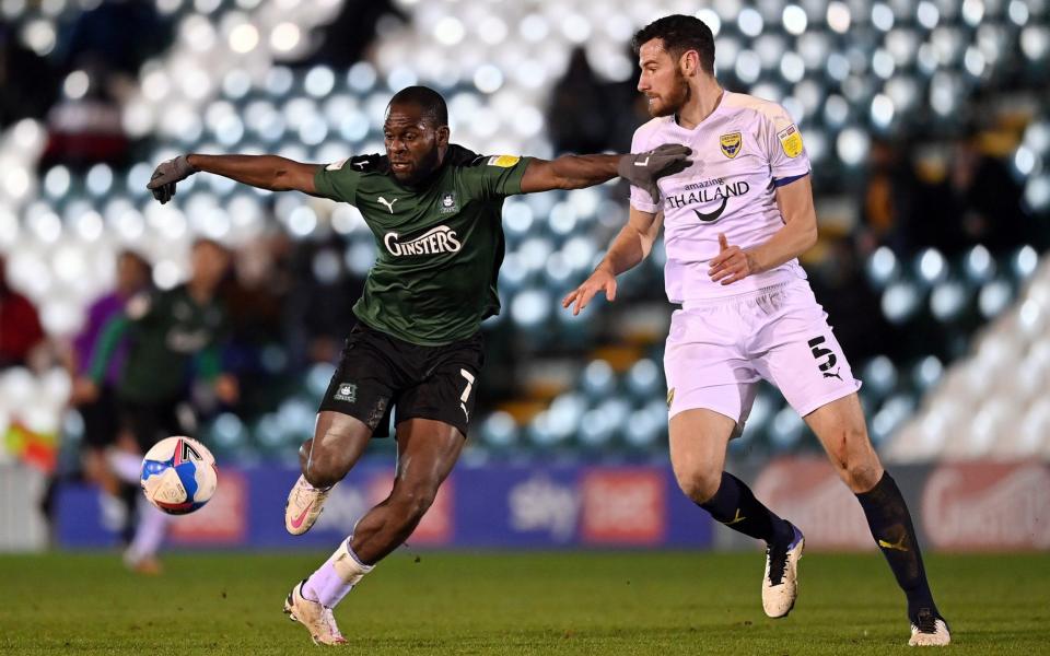 Frank Nouble of Plymouth Argyle holds off Elliott Moore of Oxford United during the Sky Bet League One match between Plymouth Argyle and Oxford United - GETTY IMAGES