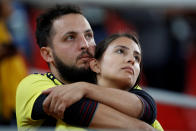 <p>Colombia fans look dejected after losing the penalty shootout. REUTERS/Carl Recine </p>