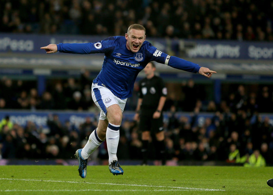 Returning hero: Rooney celebrates scoring during his second spell at Everton. (PA)