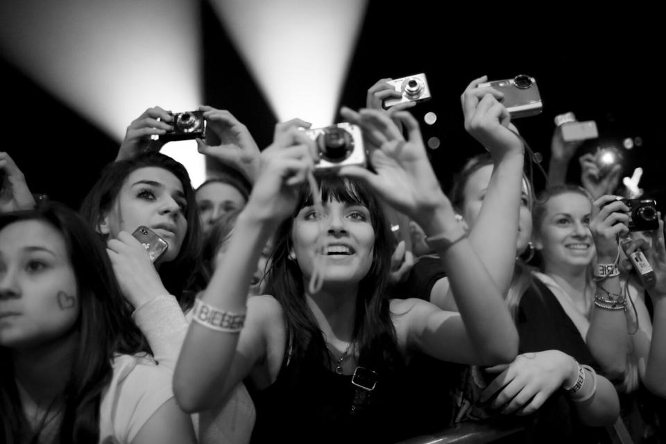 Excited fans take photos as the show begins. April 8, 2011 <b>More on Time.com:</b> <a href="http://www.time.com/time/photogallery/0,29307,2053165,00.html" rel="nofollow noopener" target="_blank" data-ylk="slk:Photos: Colin Firth: The Thinking Ladies' Leading Man;elm:context_link;itc:0;sec:content-canvas" class="link ">Photos: Colin Firth: The Thinking Ladies' Leading Man</a>