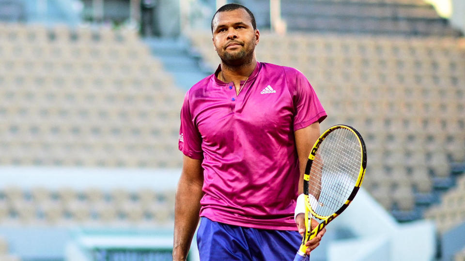 Pictured here, Jo-Wilfried Tsonga walks off after losing in the first round at the French Open.