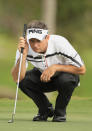 MIAMI, FL - MARCH 08: Mark Wilson lines up a putt on the 14th hole during first round of the World Golf Championships-Cadillac Championship on the TPC Blue Monster at Doral Golf Resort And Spa on March 8, 2012 in Miami, Florida. (Photo by Scott Halleran/Getty Images)