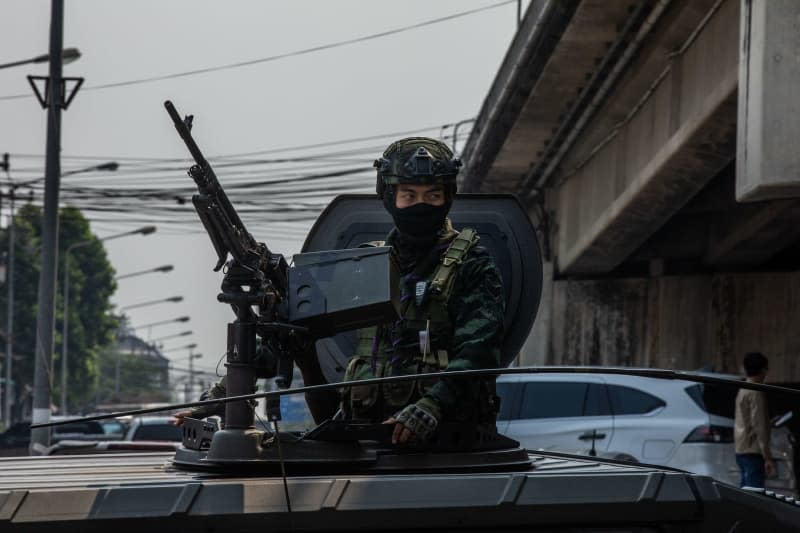 A Thai soldier looks out of an armored vehicle. Rebel groups in crisis-hit Myanmar have reportedly taken control of the important trading town of Myawaddy on the border with Thailand. Steven Note/dpa