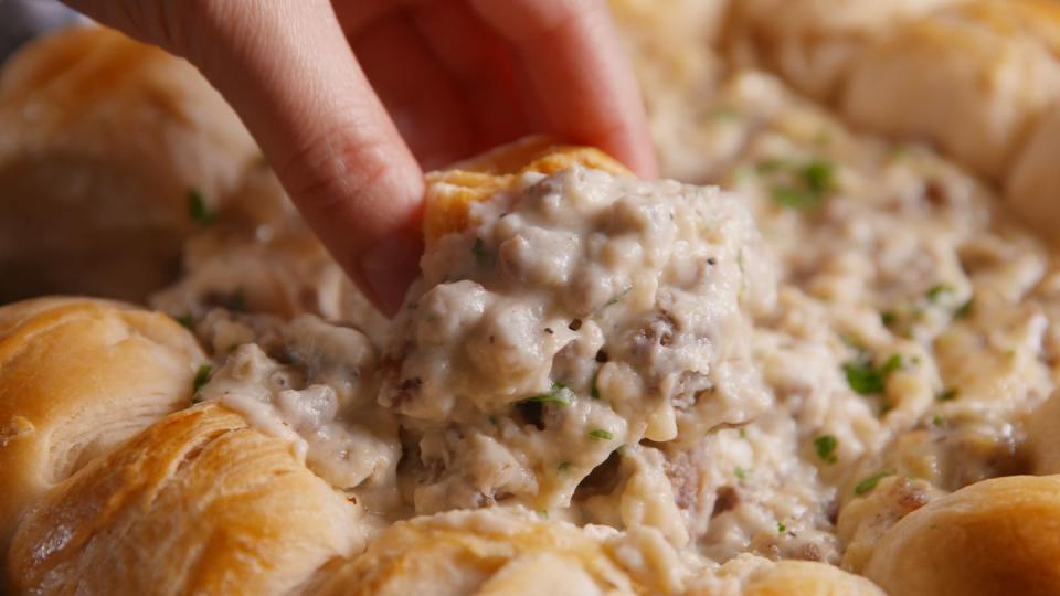 <p>Ring around the biscuits.<br></p><p>Get the recipe from <a href="https://www.countryliving.com/cooking/recipes/a50101/biscuit-and-gravy-ring-recipe/" rel="nofollow noopener" target="_blank" data-ylk="slk:Delish;elm:context_link;itc:0;sec:content-canvas" class="link ">Delish</a>.</p>