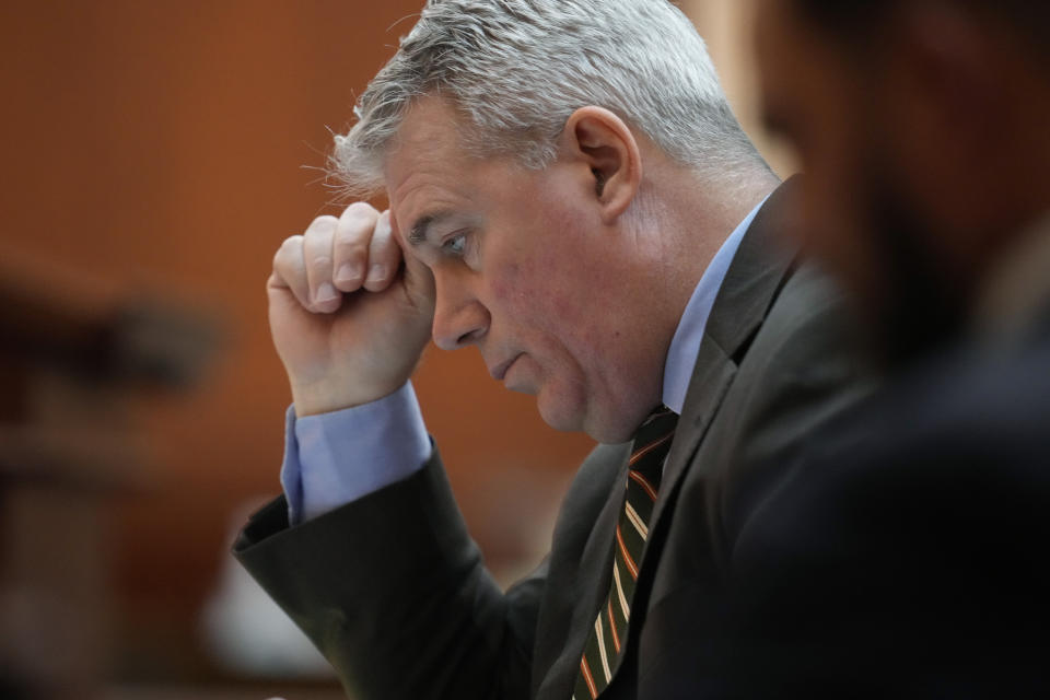Attorney Scott Gessler looks over notes before arguing before the Colorado Supreme Court on Wednesday, Dec. 6, 2023, in Denver. The oral arguments before the court were held after both sides appealed a ruling by a Denver district judge on whether to allow former President Donald Trump to be included on the state's general election ballot. (AP Photo/David Zalubowski, Pool)