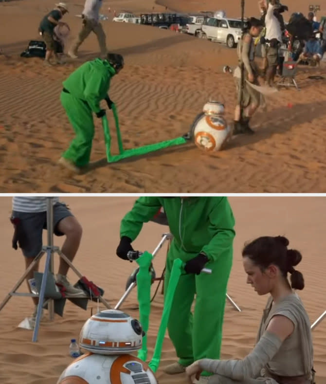 person in a green screen suit controlling the small robot