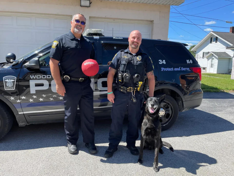 From left are retired Woodville Chief Roy Whitehead, new Police Chief Steve Gilkerson, and K-9 Raider in August 2022.