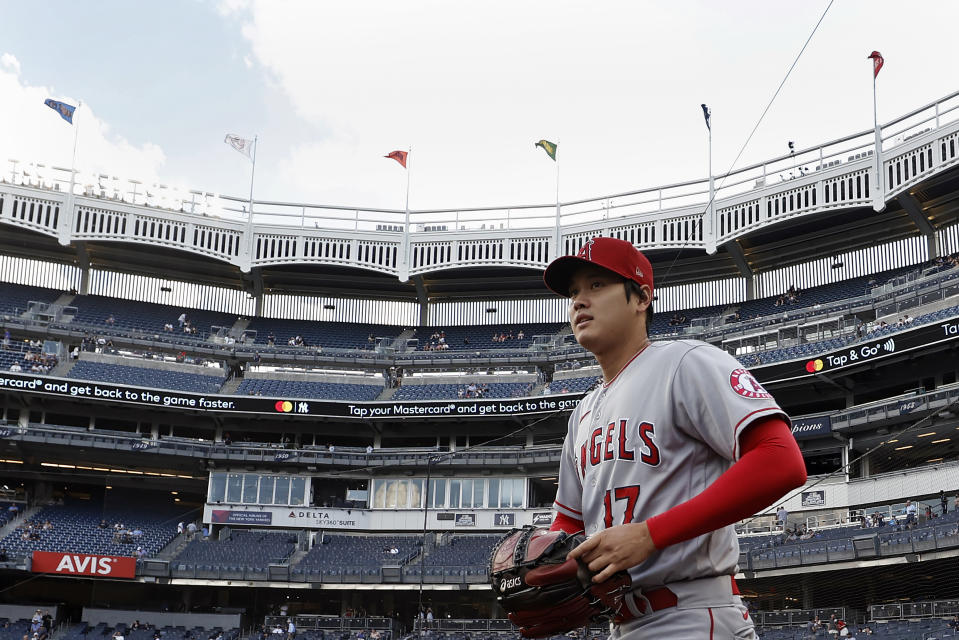 Los Angeles Angels pitcher Shohei Ohtani walks onto the field to warm up before his start against the New York Yankees in a baseball game Wednesday, June 30, 2021, in New York. (AP Photo/Adam Hunger)
