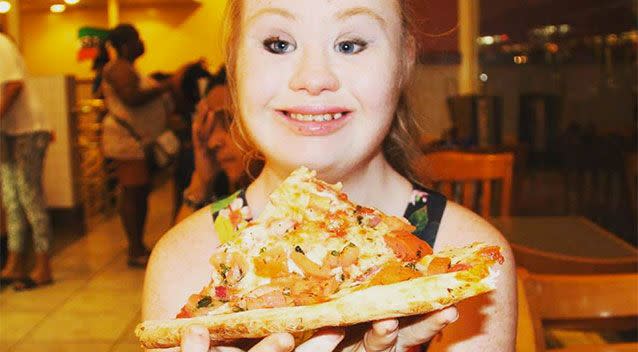 Maddie eating pizza on her whirlwind trip to NYC. Source: Facebook