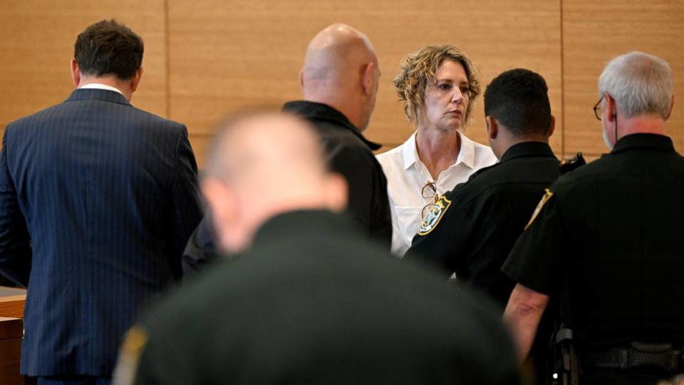 Kristen Watts is surrounded by bailiffs in the Manatee County Judicial Center after Judge Teri Dees sentenced her to 10 years in prison with credit for time served and four years of probation on April 2, 2024. Watts pleaded guilty to driving under the influence and fleeing and eluding law enforcement after she bypassed an I 275 closure and crashed into a trooper’s vehicle while a 10k was underway on the Skyway Bridge.