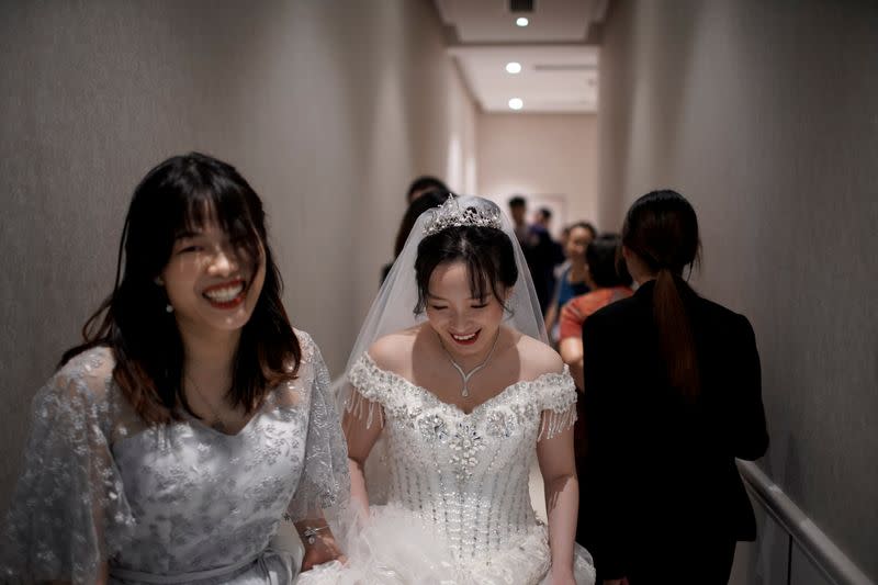 The Wider Image: Coronavirus dampens celebrations in China's wedding gown city