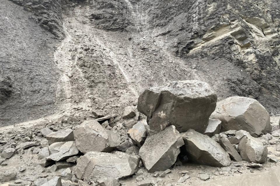 Large rocks pile up after a rockslide causing the hazardous conditions and road closure near the North Entrance Road in Yellowstone National Par