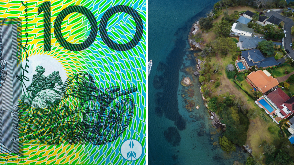 Close up of Australian $100 note. Aerial view of houses on Australian coastal headland. 