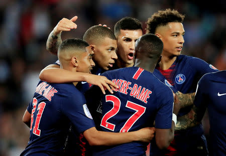 Soccer Football - Ligue 1 - Paris St Germain v AS Monaco - Parc des Princes, Paris, France - April 21, 2019 Paris St Germain's Kylian Mbappe celebrates scoring their first goal with team mates REUTERS/Gonzalo Fuentes