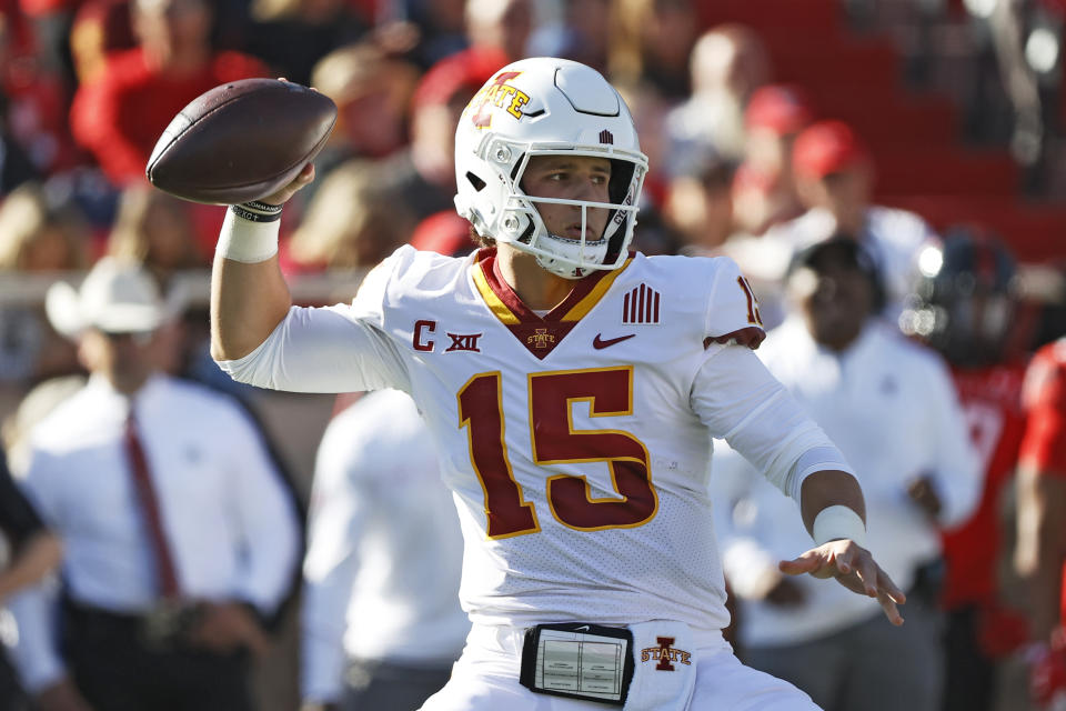 Iowa State's Brock Purdy (15) drops back to pass the ball during the first half of an NCAA college football game against Texas Tech, Saturday, Nov. 13, 2021, in Lubbock, Texas. (AP Photo/Brad Tollefson)