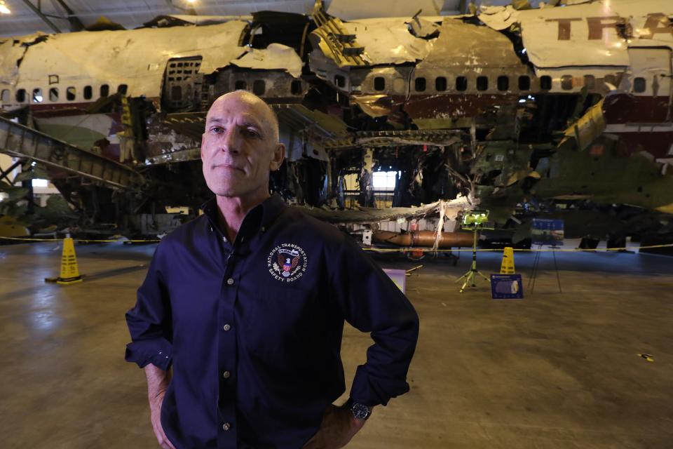 Frank Hilldrup, chief technical adviser for National Transportation Safety Board, speaks in front of the TWA Flight 800 fuselage in a large laboratory at George Washington University in Ashburn, Virginia on July 6, 2021.