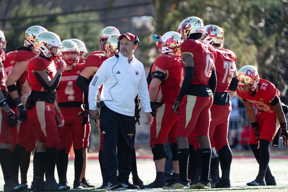 Nov 18, 2023; Oradell, NJ, USA; Donovan Catholic football at Bergen Catholic in a State, Non-Public A, semifinal game. Bergen Catholic head coach Vito Campanile talks with his team.