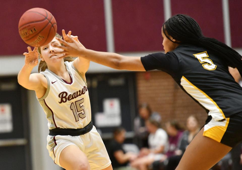 Beaver's Lauren Nesbella passes then ball around Quaker Valley's Zora Washington during the Thursday, Jan. 5 game at Beaver Area High School.