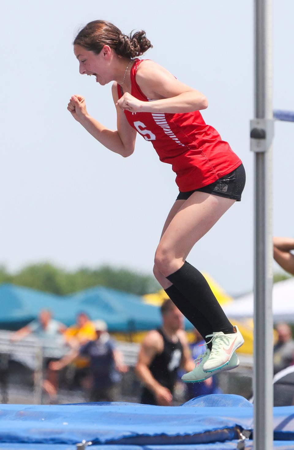 Smyrna's Brooke Duke reacts after clearing 5' 6" on her first attempt at that height to win the Division I high jump during the DIAA state high school track and field championships Saturday, May 22, 2022 at Dover High School.