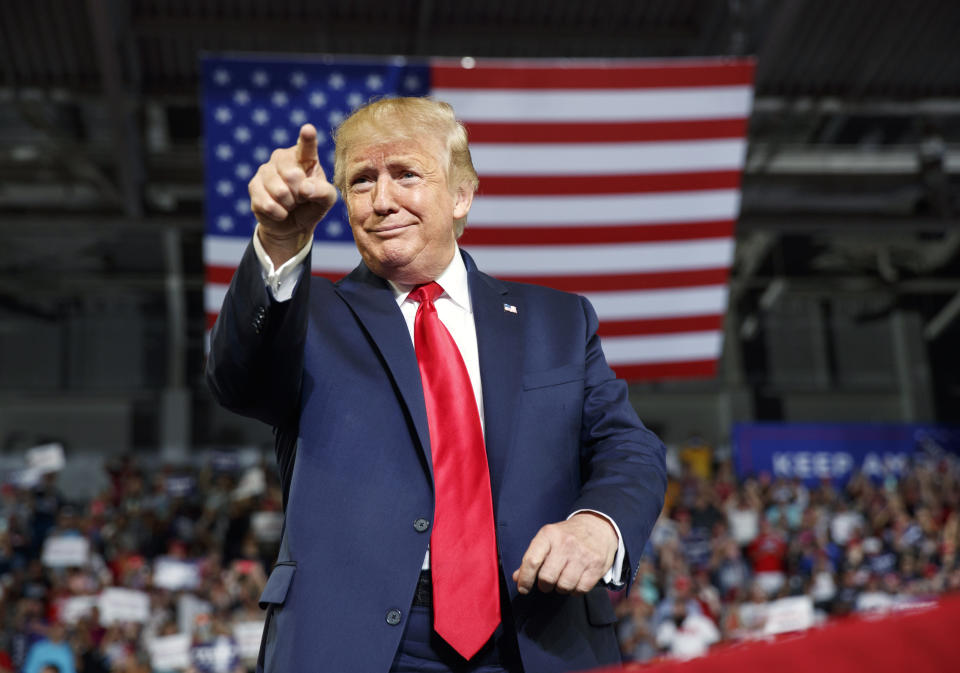 President Donald Trump gestures to the crowd as he arrives to speak at a campaign rally at Williams Arena in Greenville, N.C., Wednesday, July 17, 2019. (AP Photo/Carolyn Kaster)