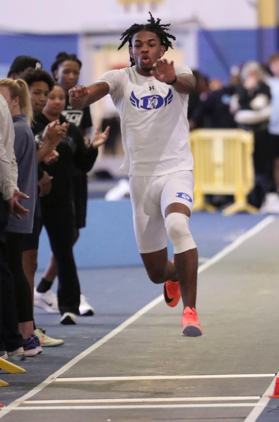 Dover's Jakwon Kilby leaps on his way to winning the triple jump during the DIAA indoor track and field championships at the Prince George's Sports and Learning Complex in Landover, Md., Saturday, Feb. 3, 2023.