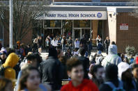 <p>Students file out of Perry Hall High School in Perry Hall, Md., Wednesday, March 14, 2018, during a student walkout. Students across the country planned to participate in walkouts Wednesday to protest gun violence, one month after the deadly shooting inside a high school in Parkland, Florida. (Photo: Patrick Semansky/AP) </p>