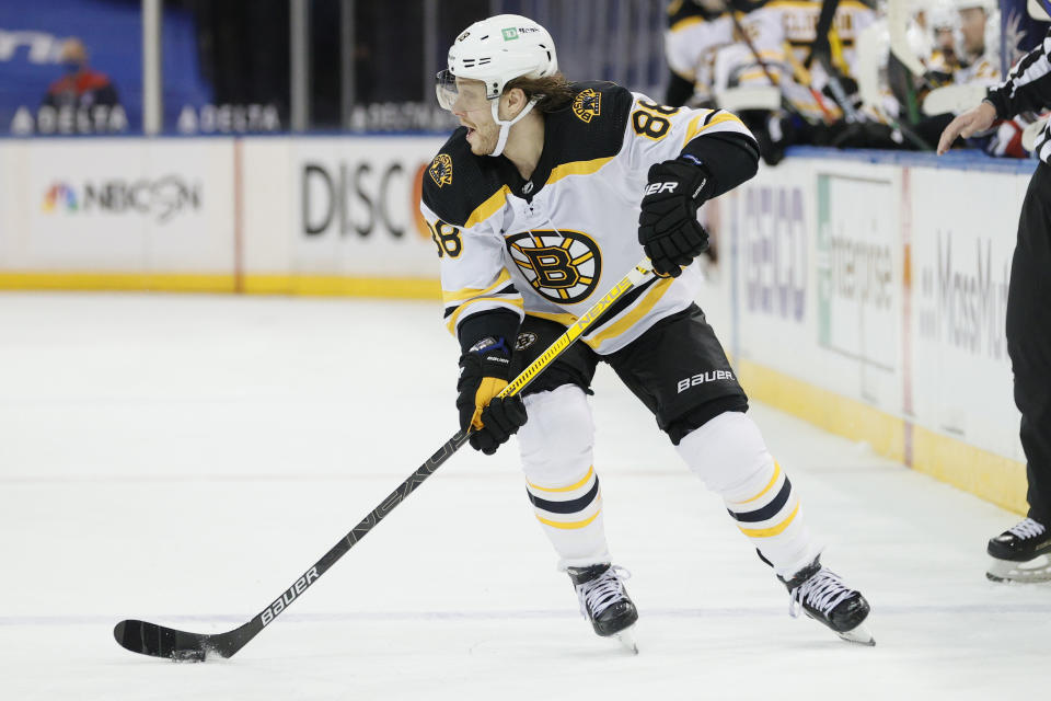 David Pastrnak of the Boston Bruins skates with the puck during the third period of an NHL game against the New York Rangers at Madison Square Garden Sunday, Feb. 28, 2021 in New York. (Sarah Stier/Pool Photo via AP)