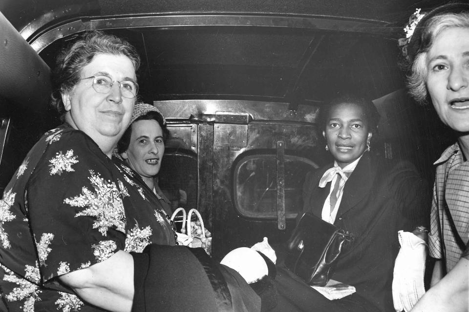 Communist Party members from left; Elizabeth Gurley Flynn, Marion Bachrach, Claudia Jones and Betty Gannett sit calmly in a police van as they leave Federal Court in New York City, June 20, 1951, en route to the Women's House of Detention after arraignment on charges of criminal conspiracy to teach and advocate the overthrow of the government by force and violence. New Hampshire Gov. Chris Sununu is calling for a review of the state’s historical marker program after two government officials objected to one of Flynn, who was born in Concord. (AP Photo)