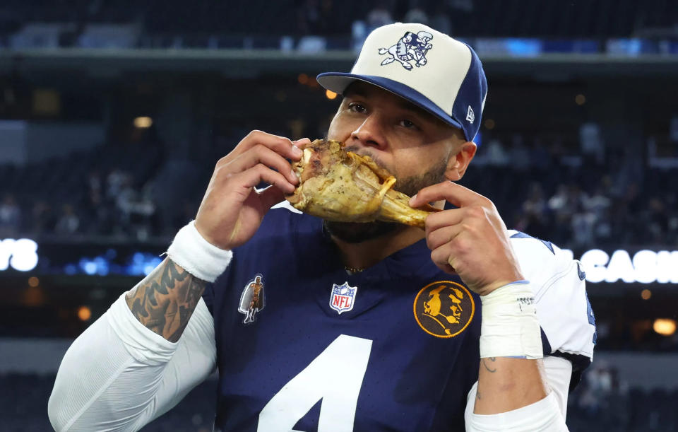 Dak Prescott eating turkey without a care in the world against the Washington Commanders.