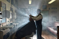 <p>A customer of the Headhunters Barber Shop and Railway Museum in Enniskillen, Northern Ireland gets a haircut from station master Nigel Johnston. </p>