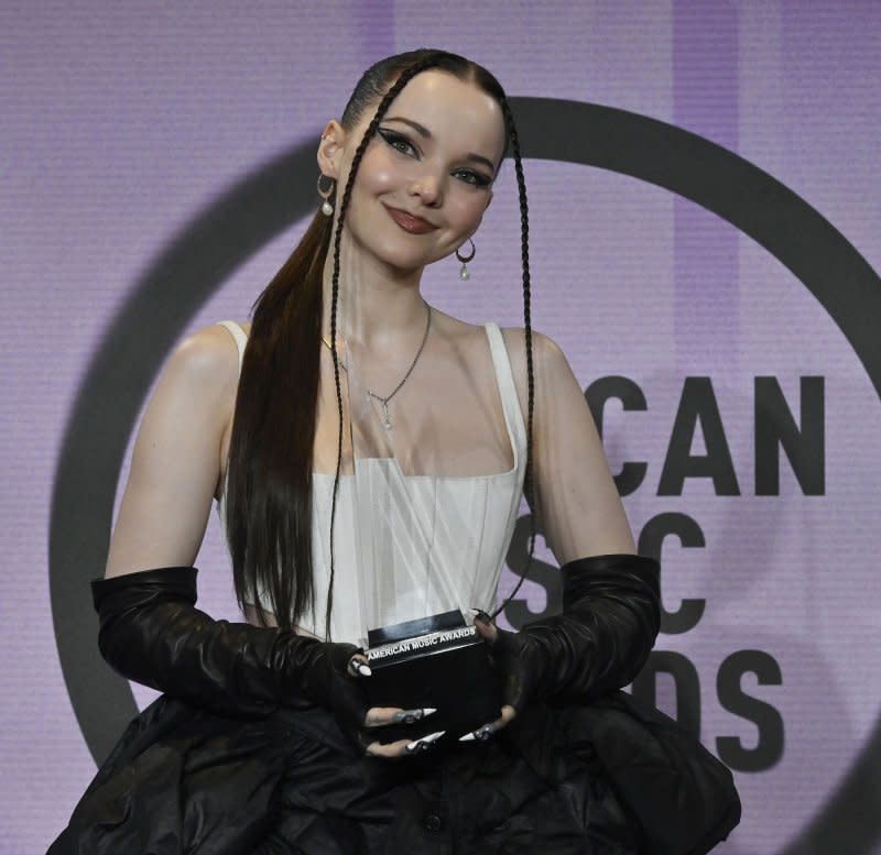 Dove Cameron, winner of the New Artist of the Year award, appears backstage during the 50th annual American Music Awards at the Microsoft Theater in Los Angeles on November 20, 2022. The singer turns 28 on January 15. File Photo by Jim Ruymen/UPI