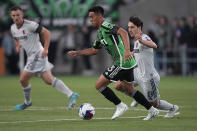 Austin FC midfielder Owen Wolff (33) moves the ball past St Louis City FC midfielder Jared Stroud (8) during the first half of an MLS soccer match in Austin, Texas, Saturday, Feb. 25, 2023. (AP Photo/Eric Gay)