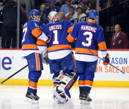 May 6, 2016; Brooklyn, NY, USA; New York Islanders goalie Thomas Greiss (1) being helped off the ice after suffering equipment problem during the second period of game four of the second round of the 2016 Stanley Cup Playoffs at Barclays Center. Mandatory Credit: Brad Penner-USA TODAY Sports