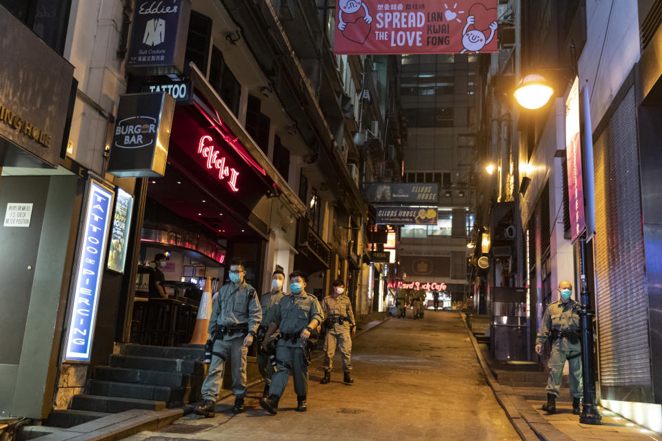 HONG KONG, CHINA - 2020/03/23: Police officers patrol around the Lan Kwai Fong area.
Chief Executive of Hong Kong Chief Executive of Hong Kong Carrie Lam announced today, March 23rd, 2020, a temporary ban on alcohol sales in 8,600 restaurants and bars that hold a liquor licence, after a series of confirmed Covid-19 cases involved people who had been to entertainment areas such as Lan Kwai Fong. (Photo by May James/SOPA Images/LightRocket via Getty Images)