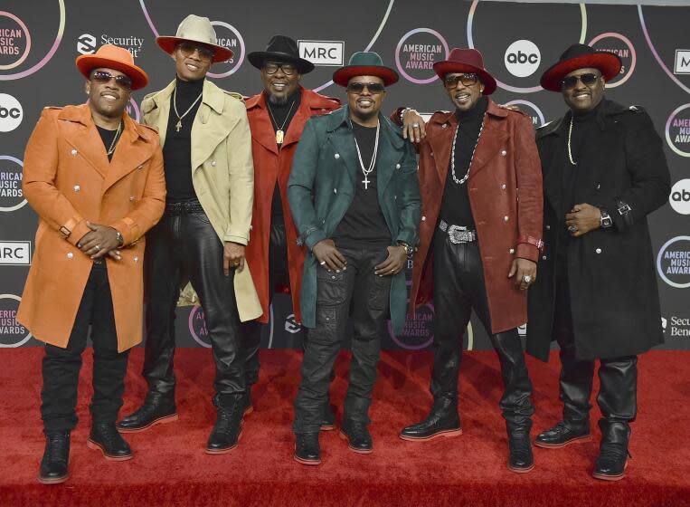 New Edition's Michael Bivins, Ronnie Devoe, Bobby Brown, Ricky Bell, Ralph Tresvant and Johnny Gill pose on a red carpet