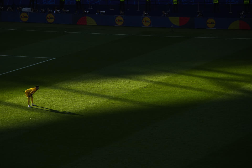 Croatia's goalkeeper Dominik Livakovic stands in the sun and follows the other players during a Group B match between Spain and Croatia at the Euro 2024 soccer tournament in Berlin, Germany, Saturday, June 15, 2024. (AP Photo/Petr Josek)