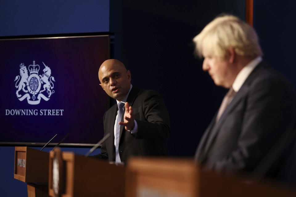 FILE - Britain's Health Secretary Sajid Javid, left, and Prime Minister Boris Johnson during a media briefing on the COVID-19 pandemic, in Downing Street, London, Nov. 30, 2021. Two of Britain’s most senior Cabinet ministers have quit on Tuesday, July 5, 2022, a move that could spell the end of Prime Minister Boris Johnson’s leadership after months of scandals. Treasury chief Rishi Sunak and Health Secretary Sajid Javid resigned within minutes of each other. Javid said “I can no longer continue in good conscience.” (Tom Nicholson/Pool Photo via AP, file)