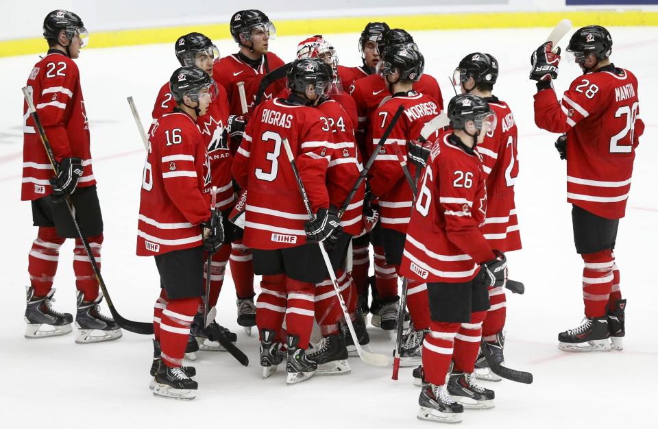 Canada's players react after their loss to Finland in their IIHF World Junior Championship ice hockey game in Malmo, Sweden, January 4, 2014. REUTERS/Alexander Demianchuk (SWEDEN - Tags: SPORT ICE HOCKEY)